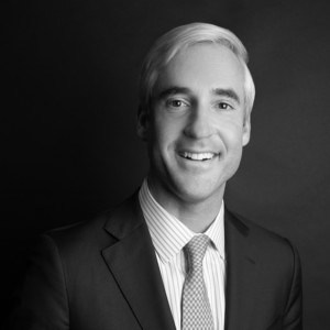 Black and white professional headshot of Tucker Knott.