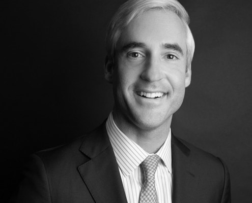 Black and white professional headshot of Tucker Knott.