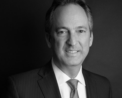 Black and white professional headshot of Justin Sayfie.