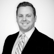 Professional headshot of Andrew Liebert in business attire