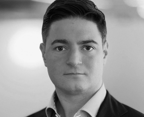 Professional headshot of Mike Rubino in business attire