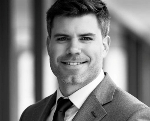 Professional headshot of Micah Ketchel in business attire